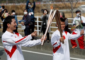 Tokyo Olympic torch relay starts in Japan amid pandemic curbs