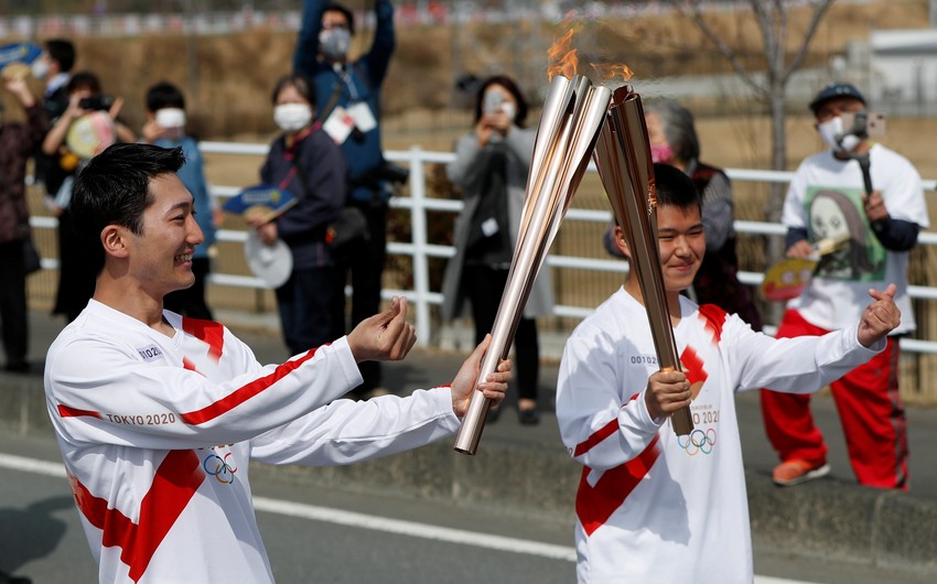 Tokyo Olympic torch relay starts in Japan amid pandemic curbs