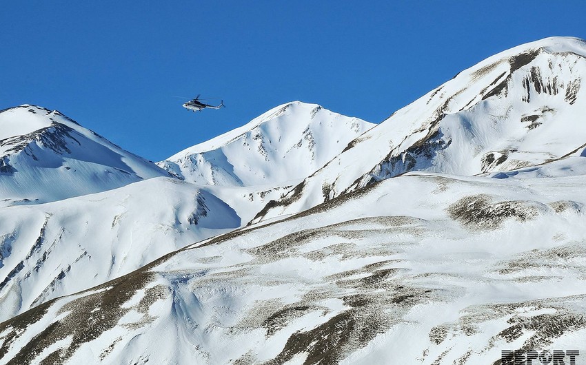 Journalists were taken to area where helicopters search for lost alpinists