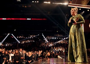 Singer Adele grabs Grammys for best song and best album