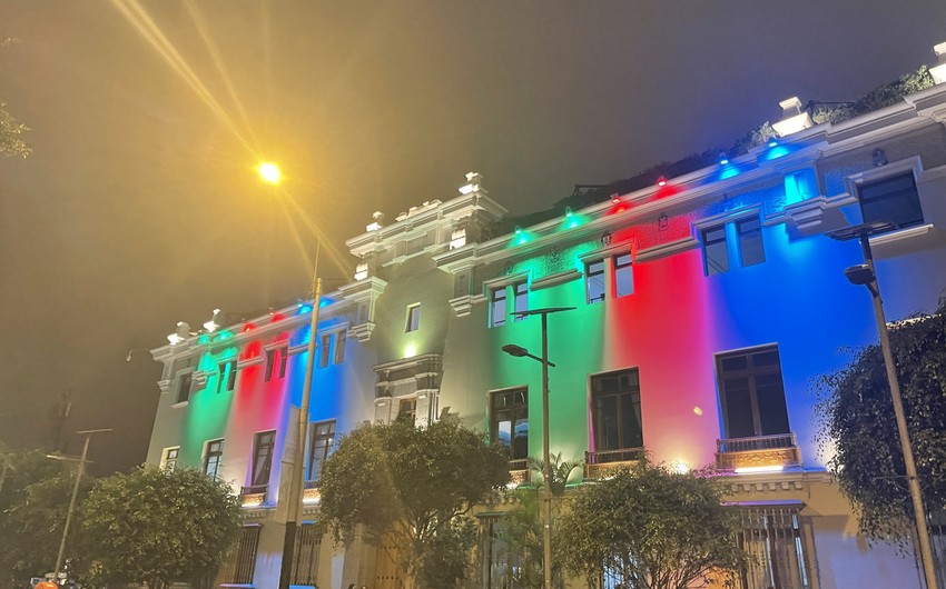 Municipal building in Peru illuminated with colors of Azerbaijani flag