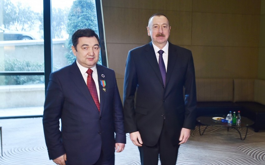 President Ilham Aliyev presents Dostlug Order to President of International Turkic Academy