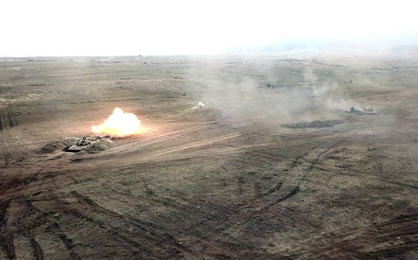 Combat firing conducted in course of large-scale exercises during daytime