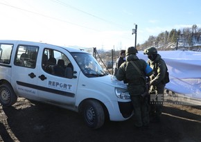 Russian peacekeeper damages Report's vehicle with his weapon