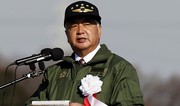 Japan’s defense minister says North Korea launched 7 missiles that flew 400 km each