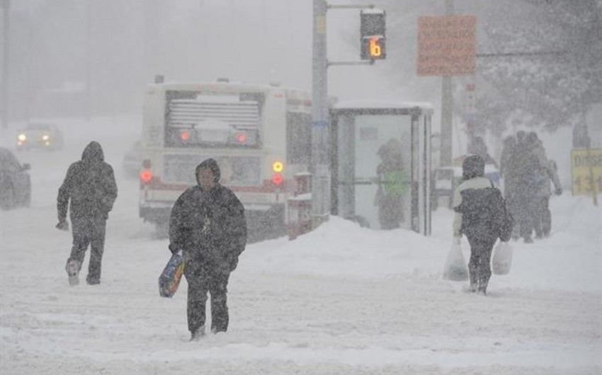 Schools and roads closed because of record snowfall in provinces of Canada