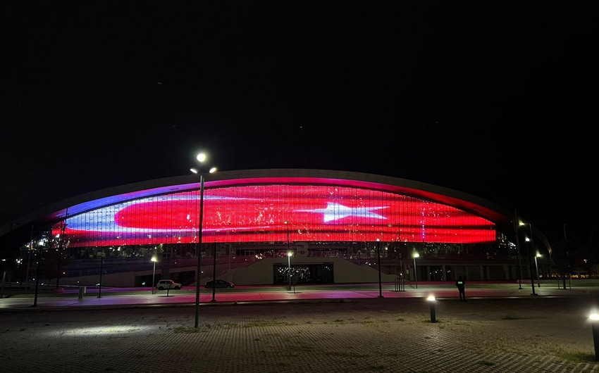 Baku Aquatic Palace illuminated in colors of Turkish Flag 