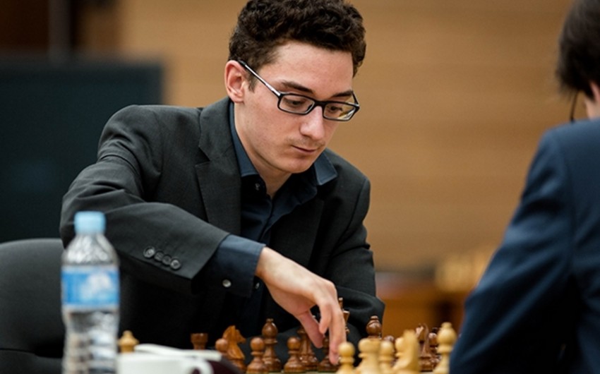 Каруана сыграл вничью с Дин Лижэнем и сохранил лидерство на турнире претендентов FIDE