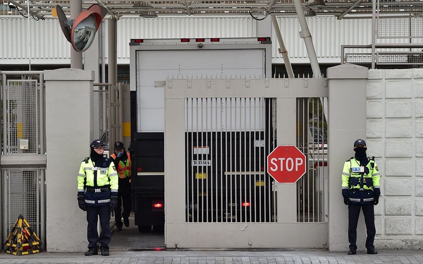 Car loaded with gas canisters rams into gates of US Embassy in Seoul