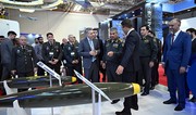 Zakir Hasanov views samples of weapons and equipment displayed at ADEX