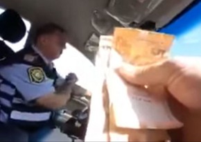 Azerbaijani police officer fired for taking bribes