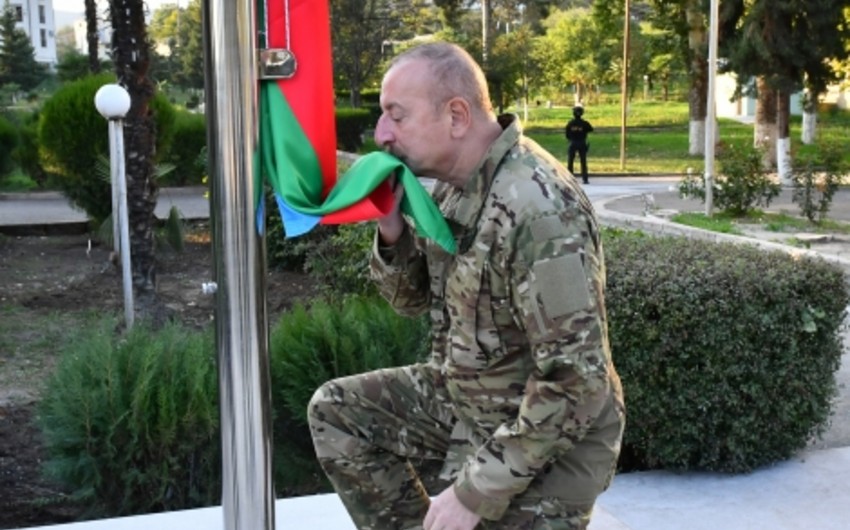 President Ilham Aliyev raises national flag of Azerbaijan in Khojavand city