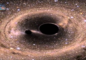 Astronomers predict merger of giant black holes 