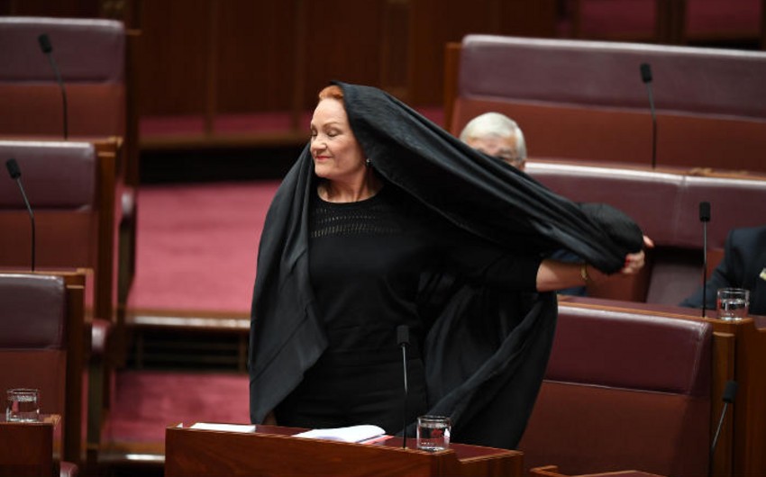 Leader of Australia’s right party comes to parliament in burqa