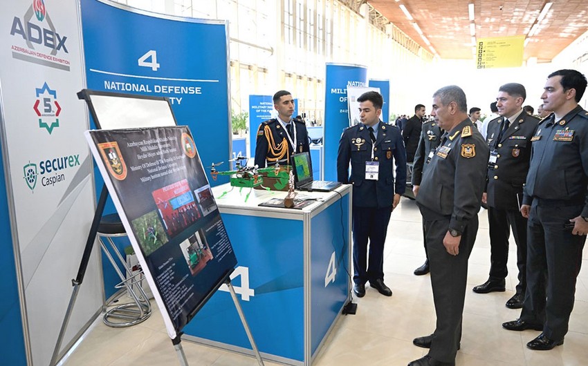 Zakir Hasanov views booth of National Defense University at ADEX exhibition