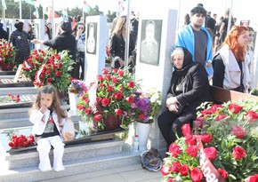 Azerbaijani people honoring memory of martyrs who gave their lives for independence of their country