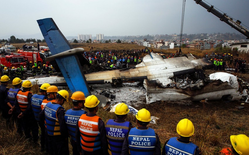 Plane slips off runway and crashes in Nepal, killing 18 people