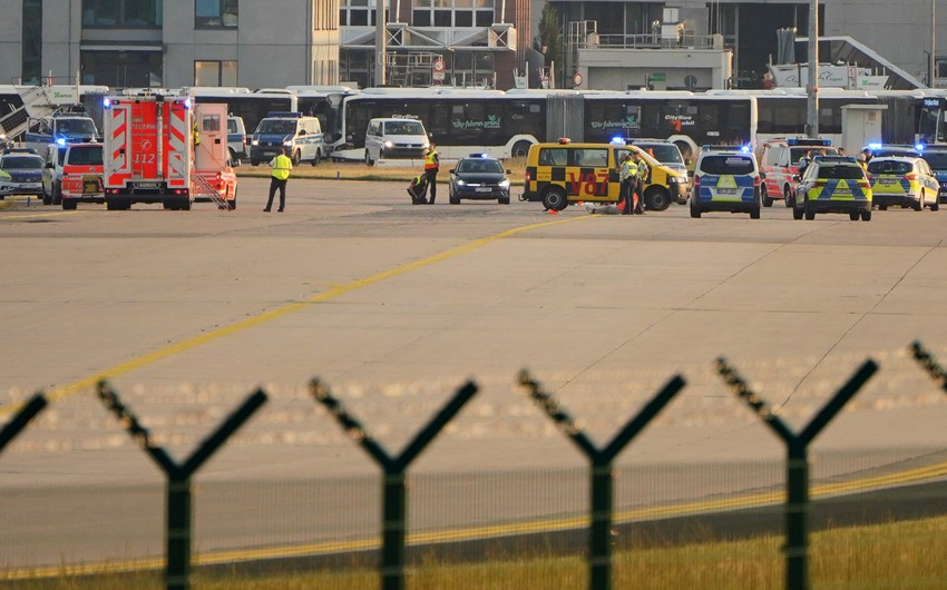 Eco-activists bring Frankfurt Airport to standstill by gluing themselves to runway