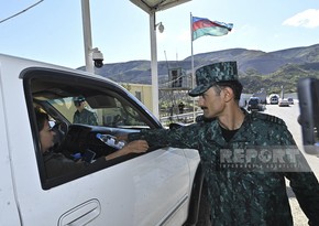Azerbaijani border guards distribute water and sweets to Armenian residents of Karabakh