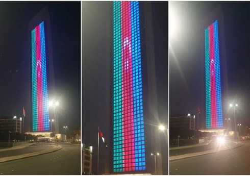 Флаг Азербайджана спроецирован на здание Национальной нефтяной компании ОАЭ