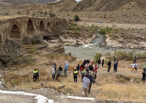 International travelers visit Khudafarin bridge 