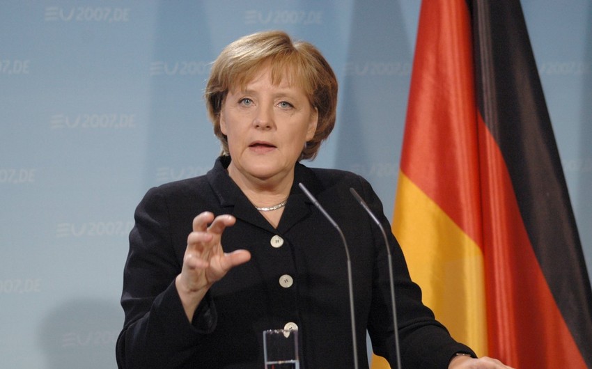 Merkel says Assad must have role in Syria talks
