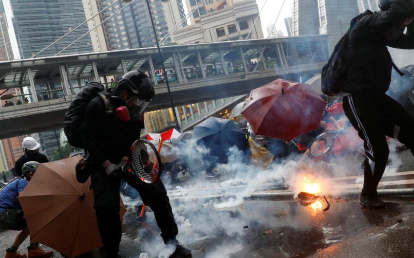 Hong Kong: Tear gas fired as protesters defy police