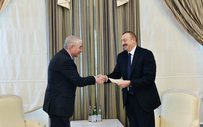 CEC Chairman Panahov presents presidential candidate certificate to Ilham Aliyev