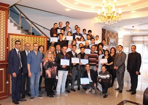 Training participants on tourism management and services were awarded