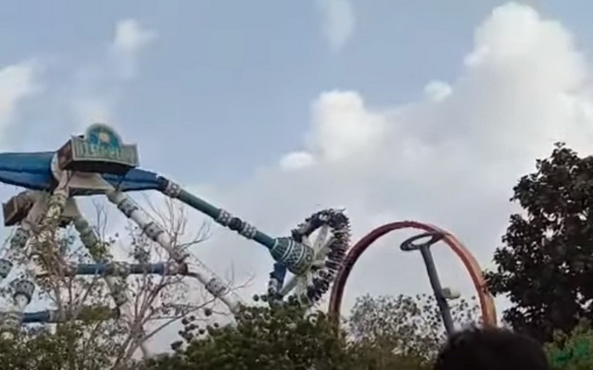 Two die and dozens are injured in theme park ride accident in India
