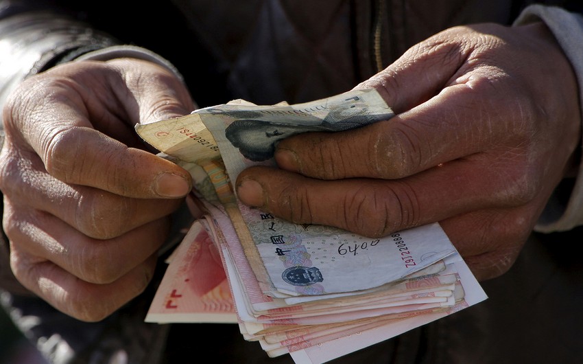 Китайцам заплатят за отказ от традиционных денег