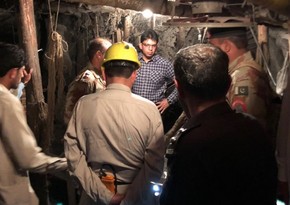 Gunmen kill 20 miners and wound others in an attack in southwest Pakistan