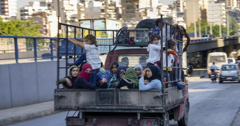 At least 200,000 people have fled Lebanon into Syria, UN says