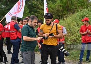 Foreign media representatives arrive at Aghdam-Khankandi road where humanitarian aid convoy stopped