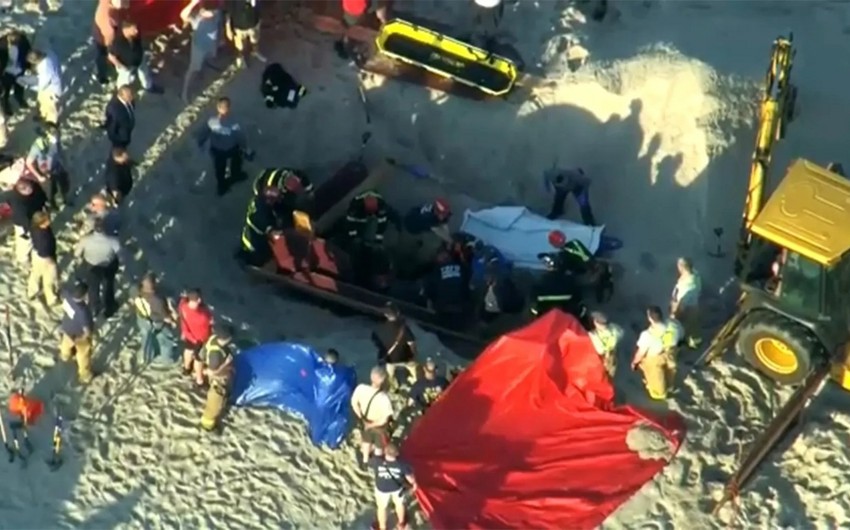 US teen digging hole on beach dead after being buried under collapsed sand