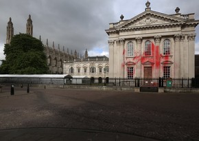 Pro-Palestinian protesters spray red paint on Cambridge graduation building