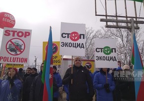 Posters depicting Armenian vandalism mounted on iron poles on Khankandi-Lachin road