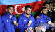 Azerbaijani wrestlers who won gold medals at World Championships return to their homeland