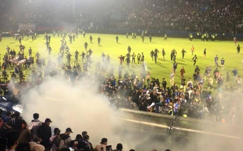 174 dead after fans stampede to exit soccer match in Indonesia