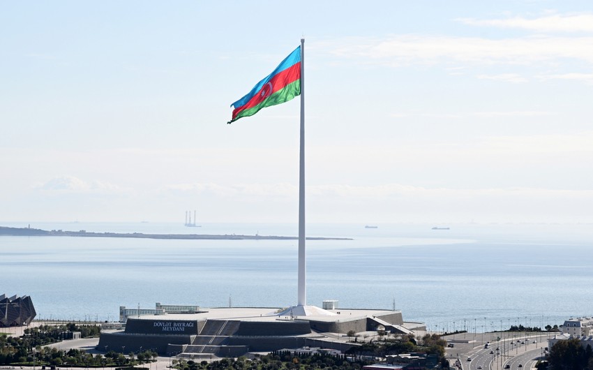 President Ilham Aliyev raises Azerbaijan's tricolor Flag at State Flag Square in Baku