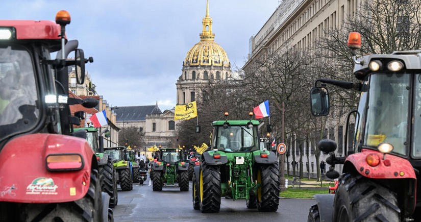 French farmers on tractors protest near European Parliament