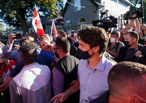 Protesters throw gravel at Canada's PM during pre-election rally