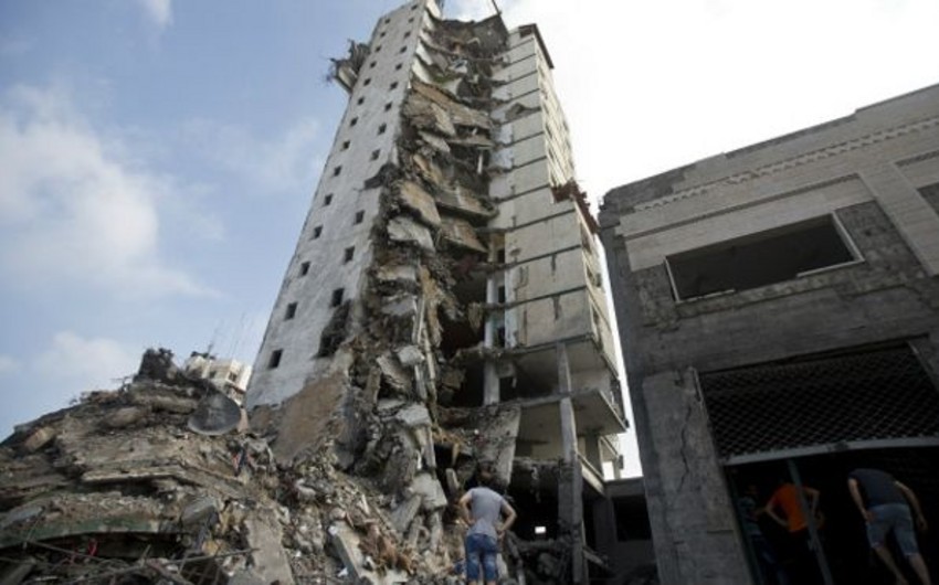 Amnesty: İsrailin Qəzzadakı binalara hücumu hərbi cinayətdir