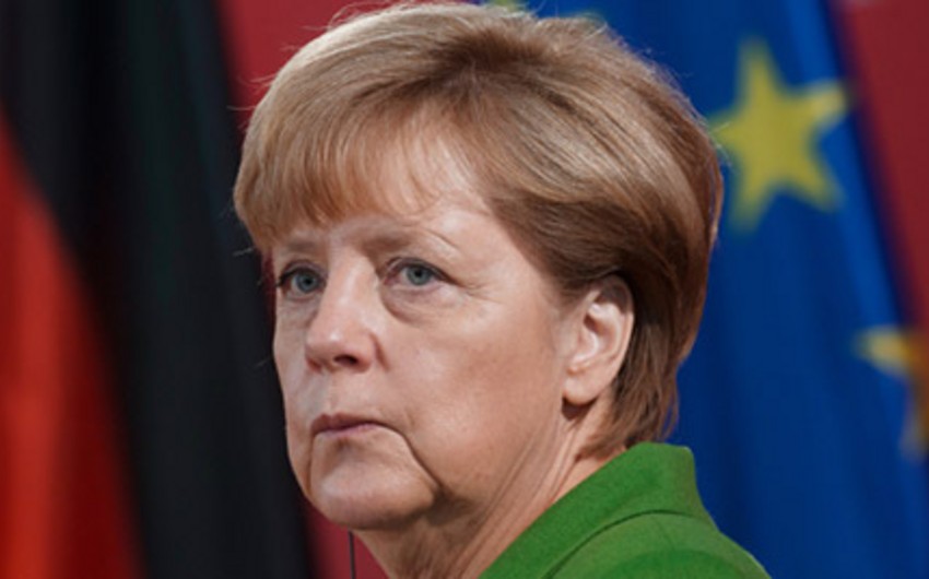 Merkel Calls Help to Migrants Germany’s National Task