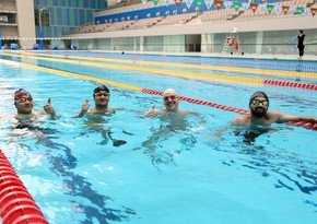 Azərbaycanın üçqat paralimpiya çempionu gənc idmançılarla görüşüb