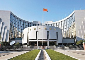 China's central bank cuts two key rates to boost economy