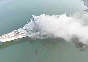 China investigating cause of fire on retired aircraft carrier