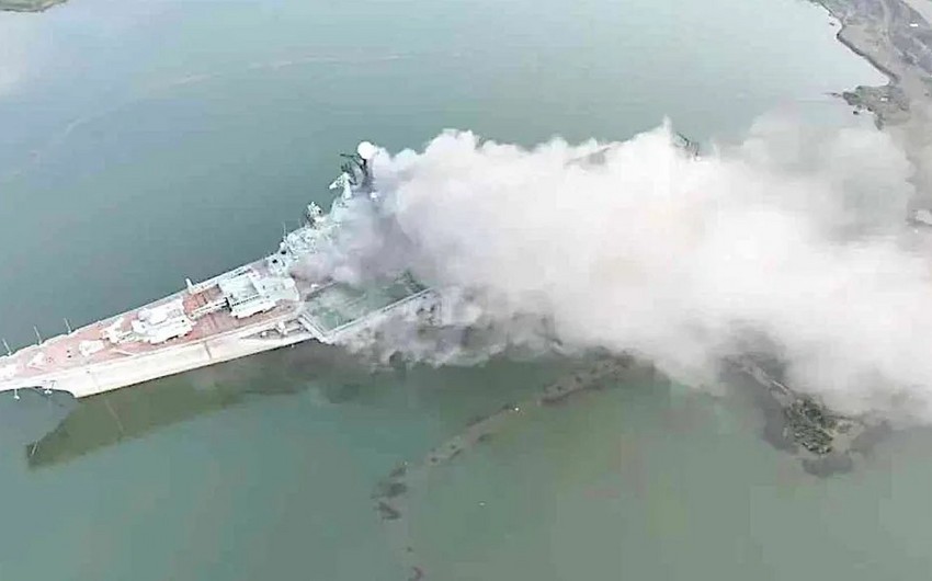 China investigating cause of fire on retired aircraft carrier