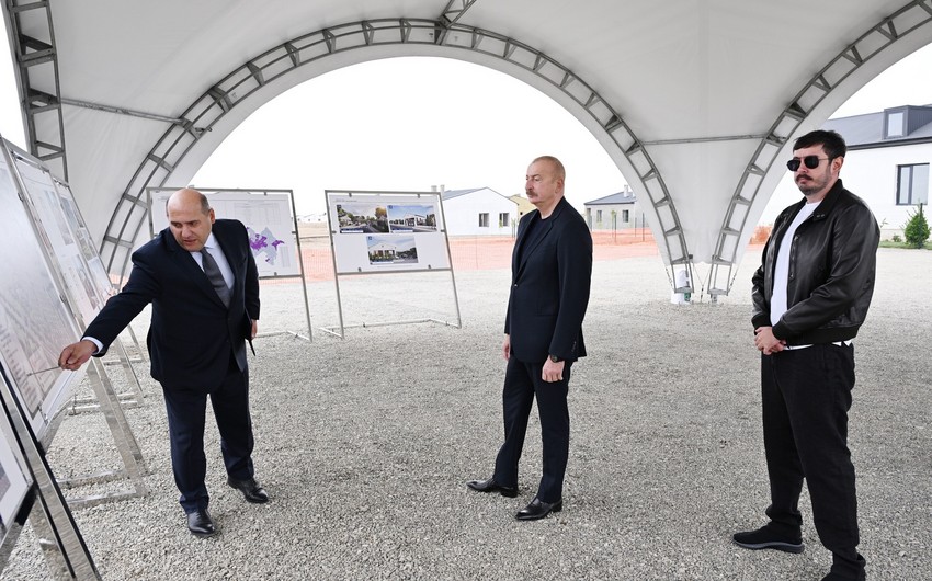 President Ilham Aliyev and his son Heydar Aliyev view progress of restoration works in Kangarli