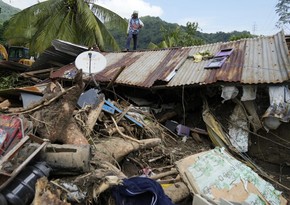 At least 126 dead and missing in massive flooding and landslides in Philippines